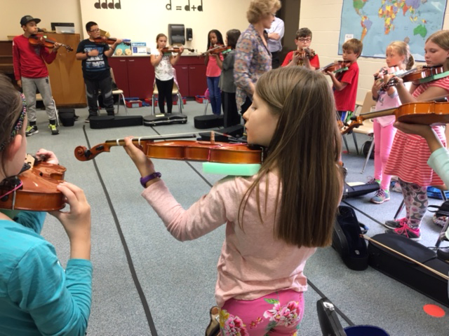 Photo of young girl with a violin.