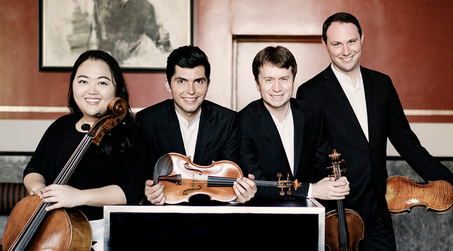 Photo of all four members of the Calidore String Quartet