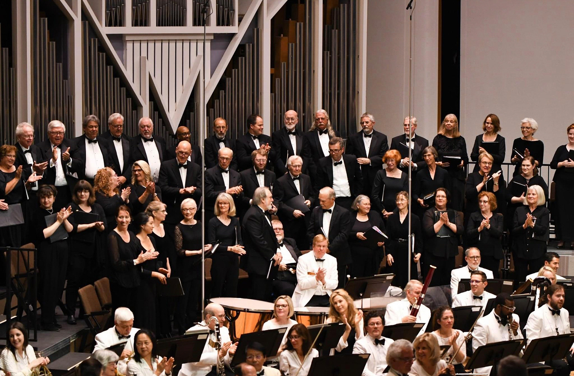 Photo of the Bellingham Festival of Music Orchestra with the Chorus behind them on stage.