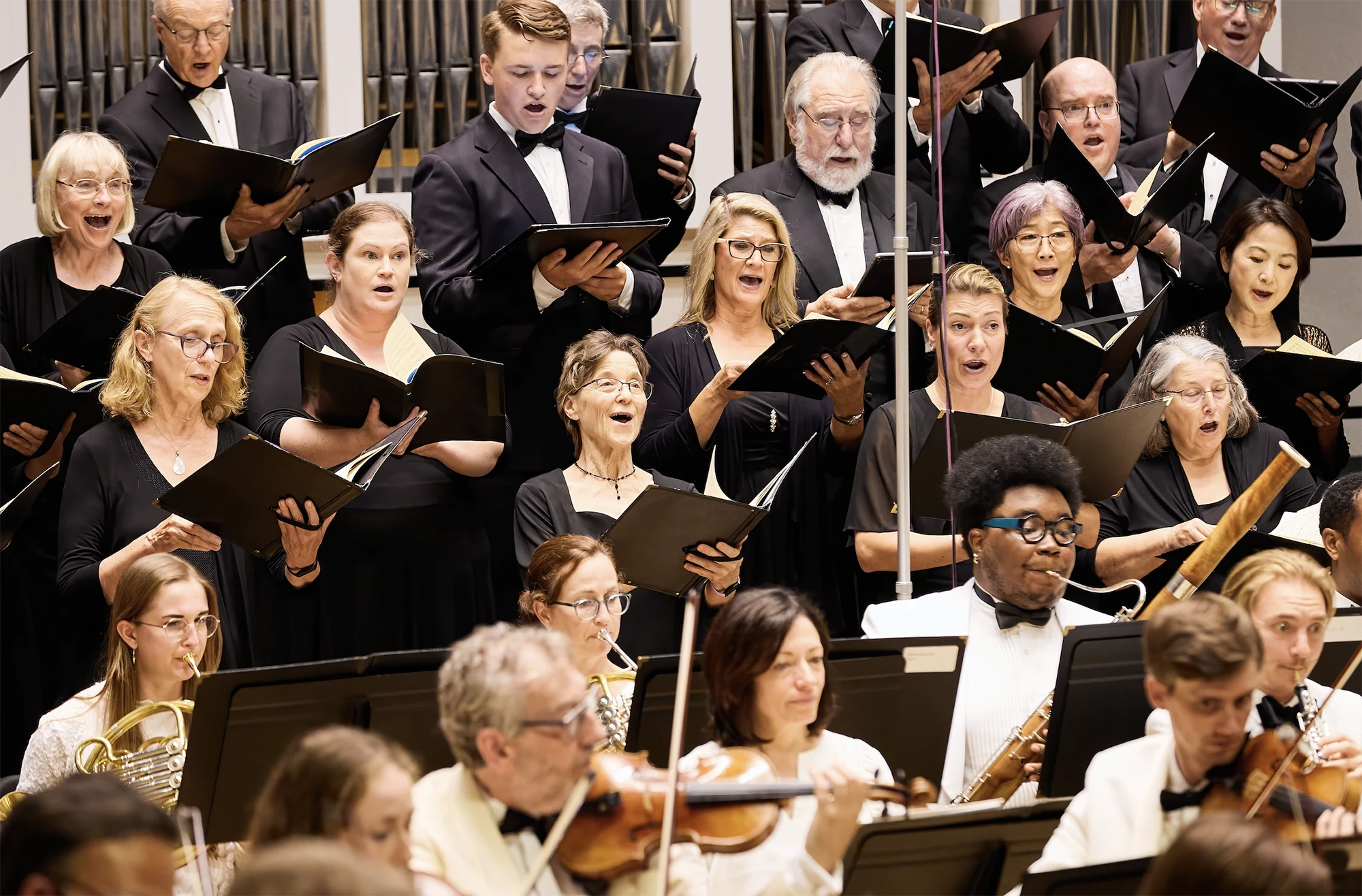 Photo of the Festival chorus with the orchestra in front of them.