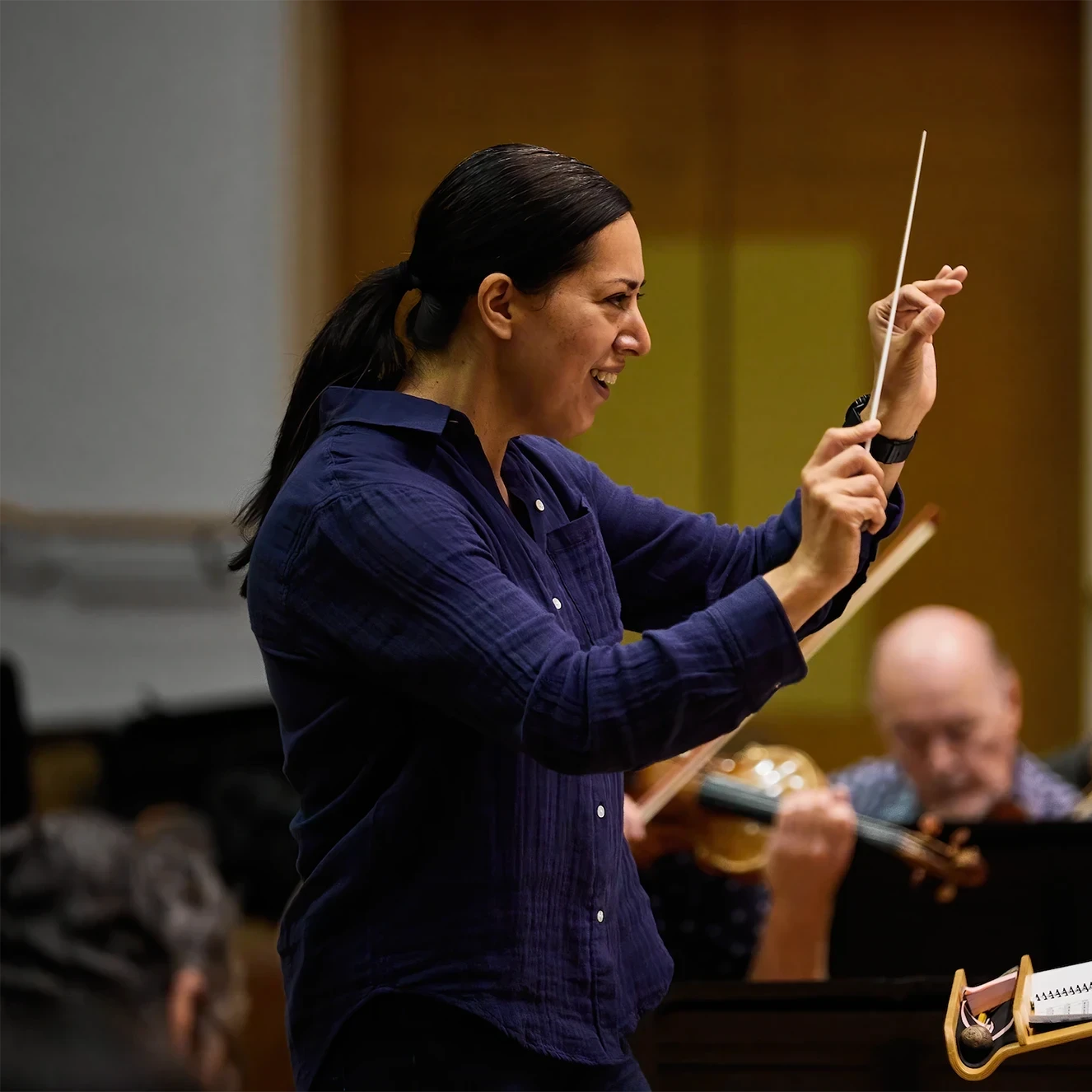 Photo of Conducting Fellow, Valery Saul leading the Festival Orchestra.