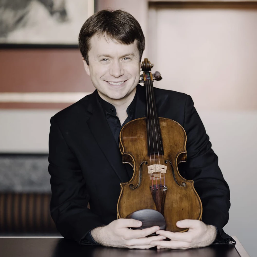 Portrait of Jeremy Berry, holding a viola.