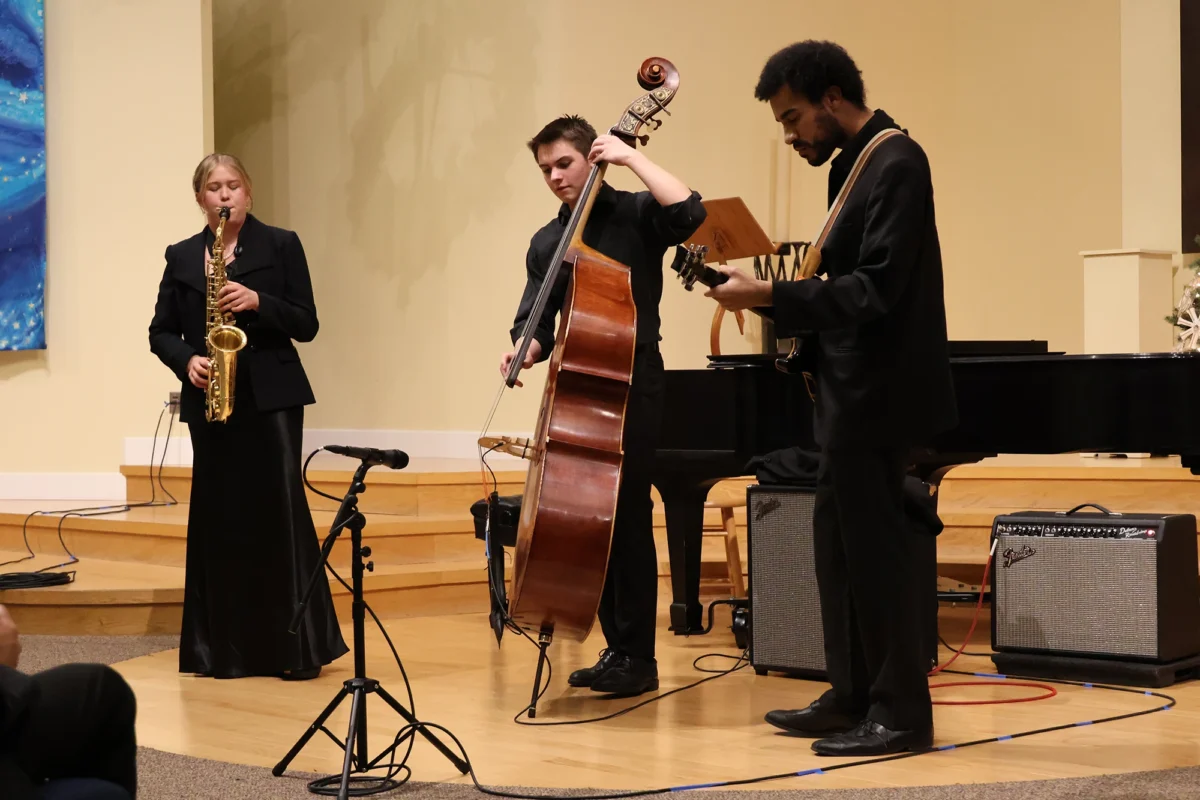 Photo of Penelope Keep and friends, playing saxophone and various string instruments.