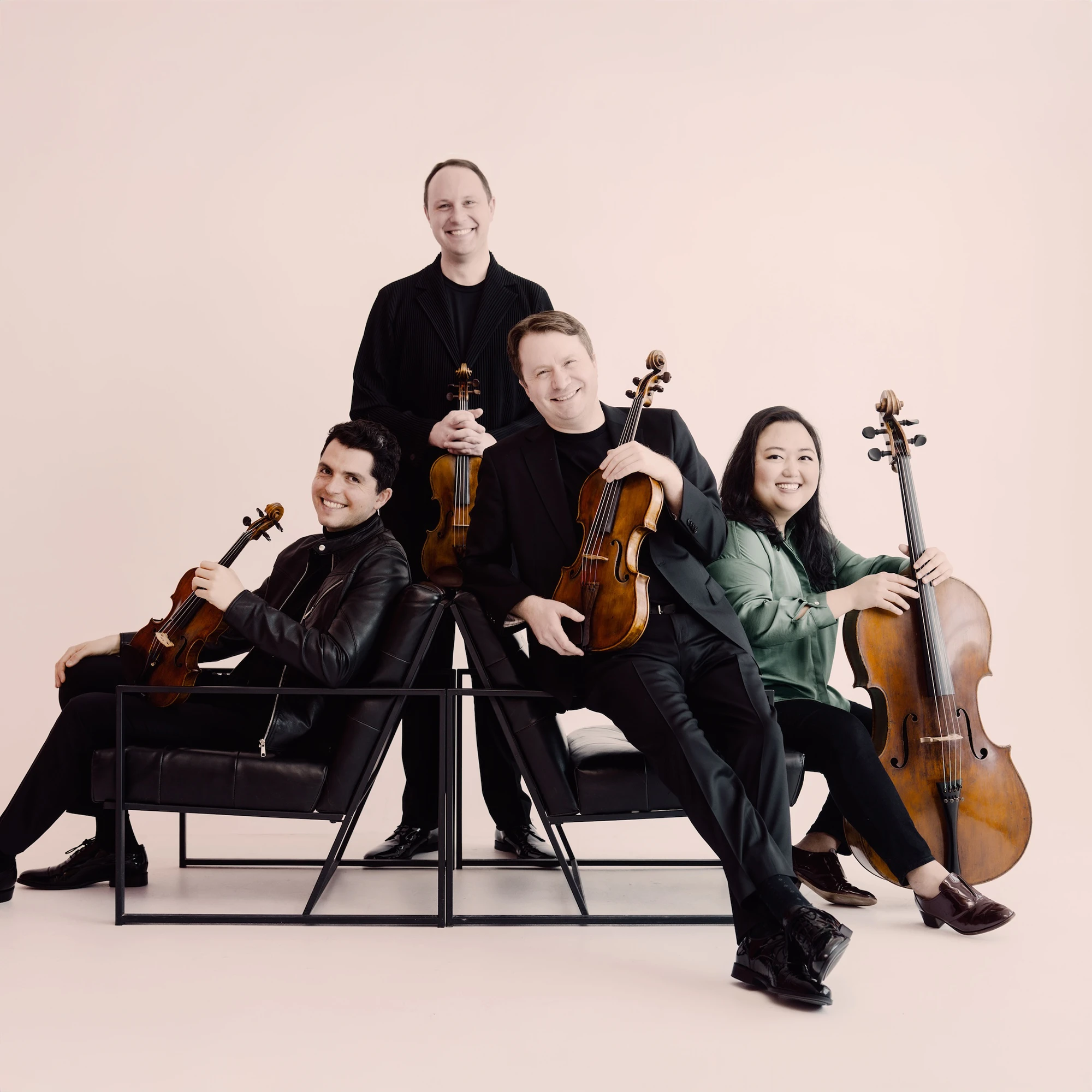 Portrait of the four members of the Calidore String Quartet.